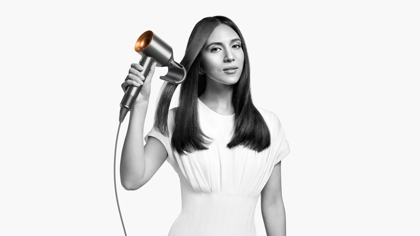 Model using Dyson Supersonic™ hair dryer 
